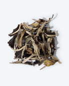 Beautiful, full leaves of bai mu dan white tea, named for the peony flower, showing dark sides and light, and the soft texture that corresponds with the distinct, delicate flavor.