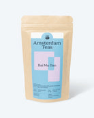 The attractive packaging for our Bai Mu Dan white tea, featuring the Amsterdam Teas logo, tasting notes, origin and preparations instructions, on a brown, kraft paper bag with zip lock.